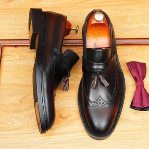 Men's wingtip brogue tassel loafers in burnished leather for business formal wear.