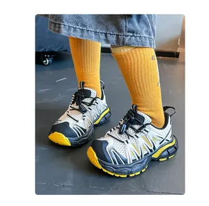 Detailed view of children's breathable mesh sneakers with chunky anti-slip yellow soles