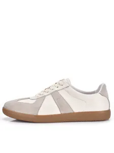 Profile view of a classic white and grey leather GAT retro sneaker with gum sole