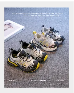 Detail view of breathable children's sneakers in multiple colors on grey carpet