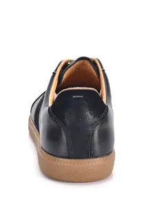 Detailed back view of men's black leather German Army Trainers with iconic gum sole