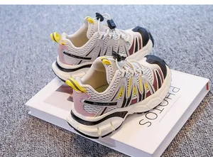 Side detail of children's breathable mesh dad sneakers with stylish yellow accents
