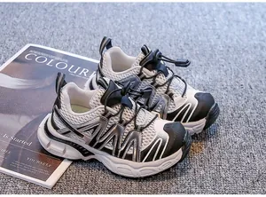 Kids breathable sports sneakers with mesh upper and thick soft sole in black and white