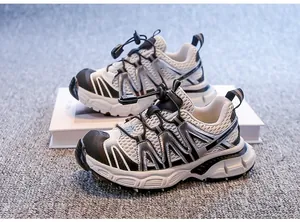 Side view of breathable mesh children's sneakers with silver accents and elastic laces