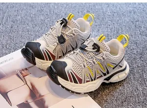 Close-up detail of children's breathable chunky sneakers with toggle lacing system.