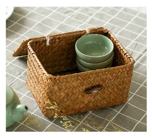 Detail view of hand-woven seagrass storage box lid and natural fiber texture details.