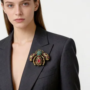 Elegant vintage enamel bee brooch with rhinestones worn on a dark grey blazer lapel
