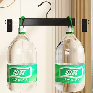 Cintre à pantalons noir mat robuste avec clips verts réglables pour rangement de vêtements