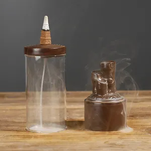 Bruciatore di incenso a riflusso Zen con base in ceramica e coperchio in vetro.
