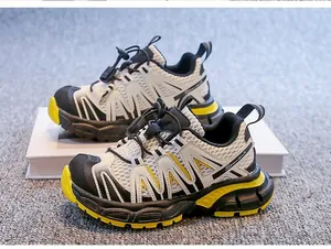 Detailed view of breathable children's sneakers in white and yellow autumn style