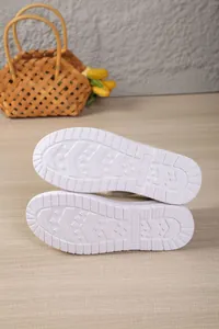 Detailed view showing the white anti-slip tread pattern on women's winter snow boot soles