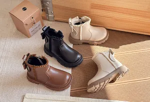 Stylish kids Martin boots in black, brown and cream with pearl trim and bow details