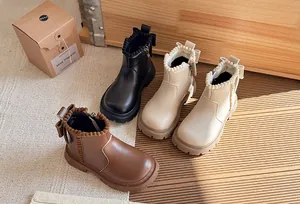 Variety of children's British style ankle boots with cute pom-pom trim and back bow detail