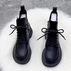 Vintage British style black Martin boots with platform sole and elegant lace-up design