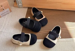 Close-up view of elegant girls' Mary Jane shoes with pearl details in a lifestyle setting
