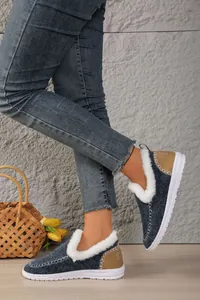 Side view of warm fleece-lined snow boots with white faux fur and durable rubber soles