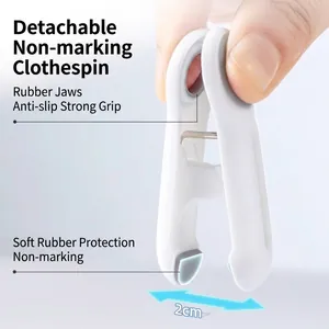 Portable white clothespin with non-slip rubber grip and 2cm wide opening.