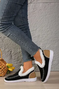 Detailed view of women's black warm fleece-lined snow boots with white faux fur trim