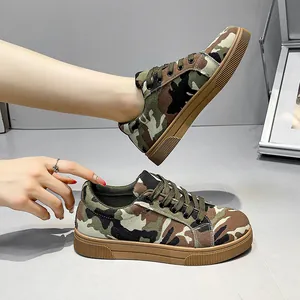 Close-up detail view of women's camouflage canvas sneakers with durable flat rubber soles