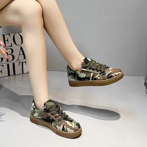 Detail view of stylish women's camouflage canvas shoes with durable flat rubber soles