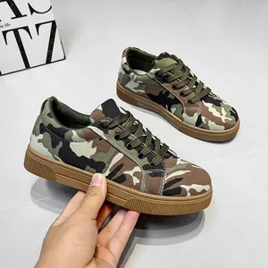 Detailed side view of women's camouflage canvas sneakers with thick rubber soles