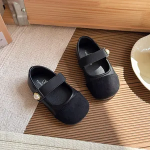 Classic black Mary Jane shoes for girls featuring an elegant pearl strap and soft soles