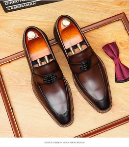High-quality brown leather men's loafers featuring elegant black metal buckle details.