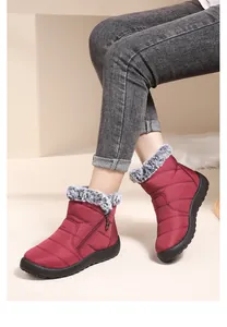 Cozy women's wine red snow boots with faux fur collar and non-slip sole for winter.