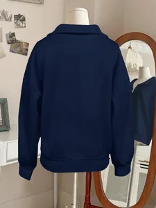 Navy blue casual half-zip lapel sweatshirt for women, back view on a mannequin