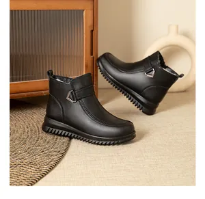 Side view of black thick-soled winter boots with plush lining and buckle detail.