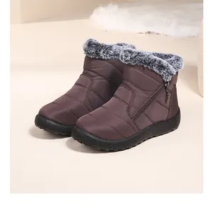 Side view of brown winter snow boots with gray faux fur trim and zipper detail