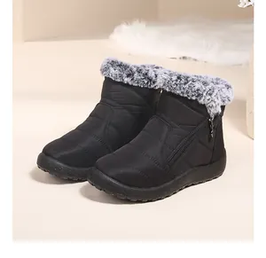 Detailed view of women's waterproof winter snow boots featuring a warm grey faux fur collar