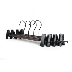 Set of 4 beech wood pants hangers with non-marking clips for closet organization