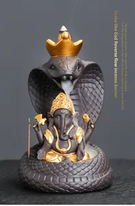 Detailed view of Ganesha backflow incense burner with snake motif and smoke effect