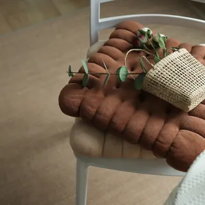 Biscuit shaped plush chair cushion for home and office dining chairs.