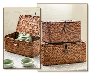 Detailed view of handmade woven bulrush storage boxes with lids and toggle closures