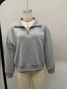 Casual grey solid color half-zip sweatshirt with collar detail displayed on mannequin