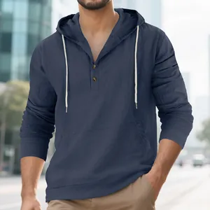 Detail shot of navy blue men's linen hooded Henley t-shirt featuring wood buttons