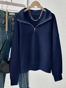 Navy blue women's half-zip sweatshirt with a polo collar in a comfortable oversized fit.