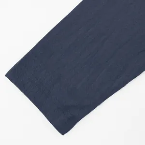 Close-up of the breathable navy blue linen fabric texture and stitching detail