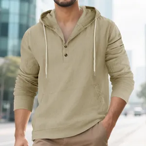 Close-up detail of men's beige linen casual hoodie with buttons and front pouch pocket.