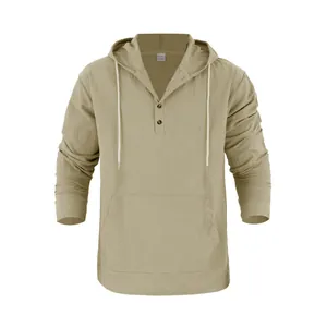 Detail of men's loose linen hooded Henley shirt with front pocket and buttons
