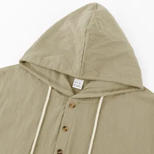 Close-up of a khaki linen hooded Henley shirt showing the texture and neck label detail.