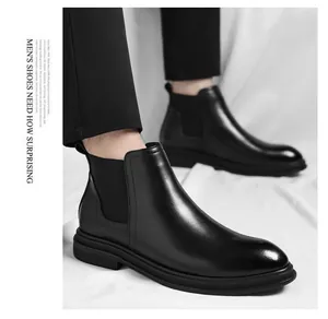 Classic black leather Chelsea boots for men featuring a sleek polished finish and elastic