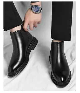 Close-up of classic black leather Chelsea boots for men with elastic side panels