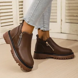 Classic British style brown round-toe ankle boots with side zipper and thick lug sole
