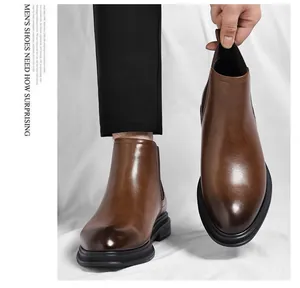 Classic men's brown leather Chelsea boots featuring a smooth textured finish and stylish fit