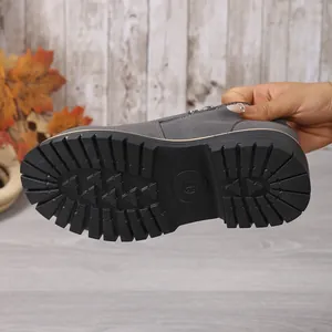 Detailed macro view of grey loafer sole showing anti-slip rubber tread and size 37 mark