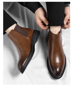Top view of classic brown leather Chelsea boots for men with high quality texture