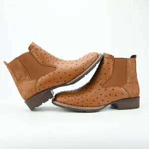 Detailed side view of brown men's Chelsea boots with unique ostrich leather texture